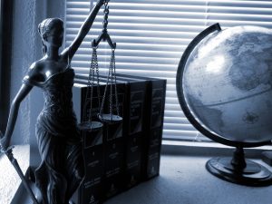 justice statue and globe