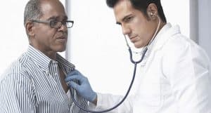 doctor listening to patients heart