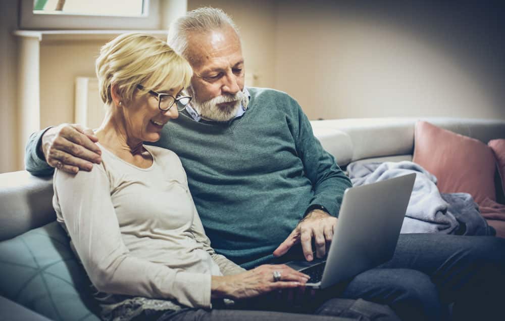 husband wife looking at computer