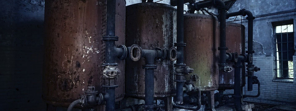 boiler room with rusted piping