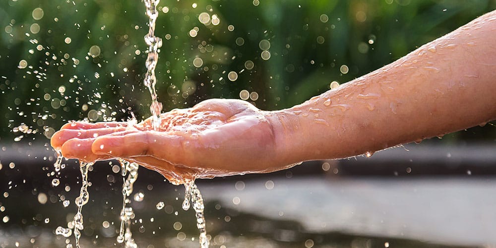 Hands with water splash