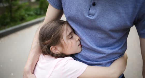child hugging father